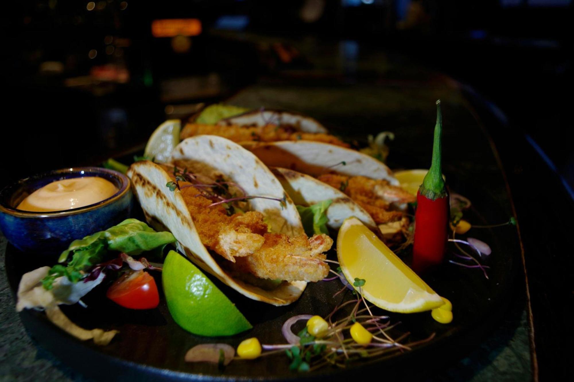 Sheraton Poznan Hotel Exterior photo A plate of grilled mussels